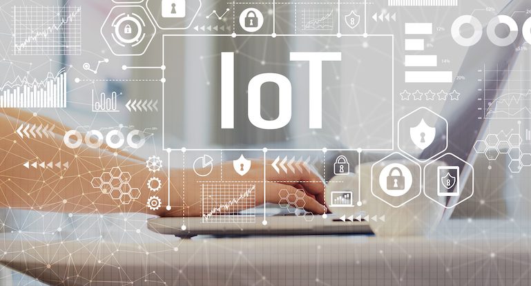 IoT with woman using a laptop on a coffee table