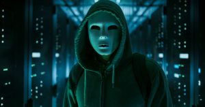 Masked Hacker in a Hoodie Standing in Corporate Data Center