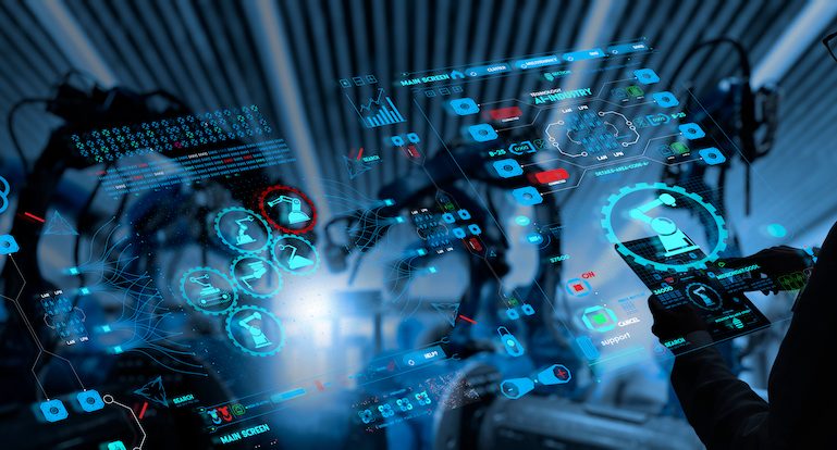 Engineer working with automation robot arms machine in intelligent factory