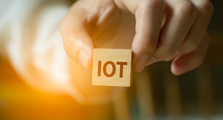 Hand holding icon iot of wood cube block