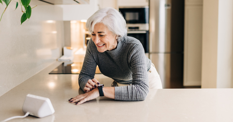 Senior woman using smart devices