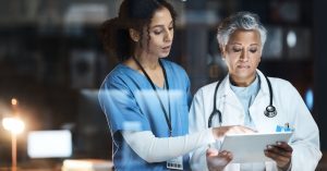 Doctors, nurse and digital tablet for night teamwork