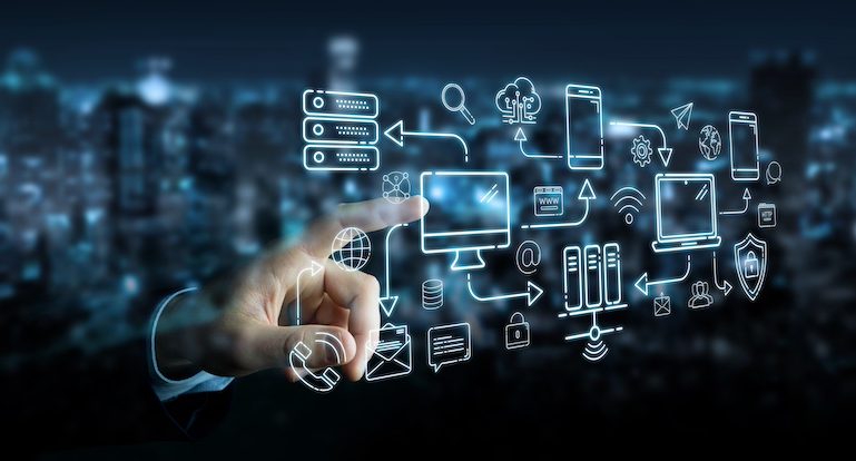 Businessman on blurred background using tech devices