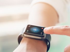 hand touching smartwatch with health app
