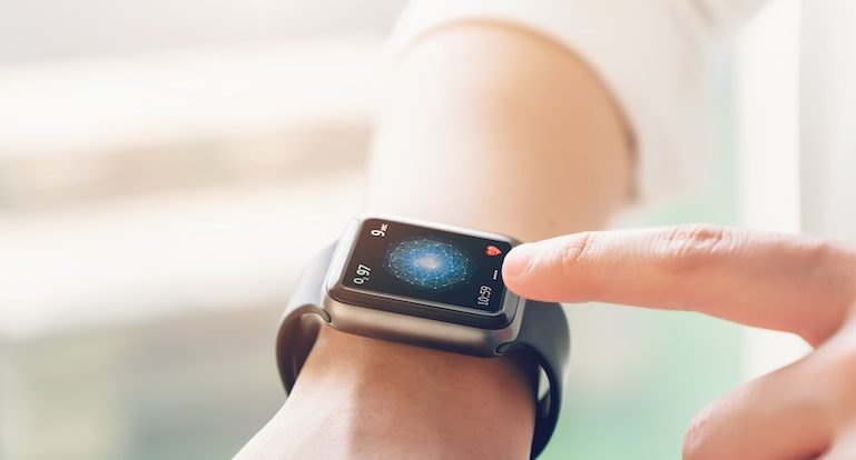 hand touching smartwatch with health app