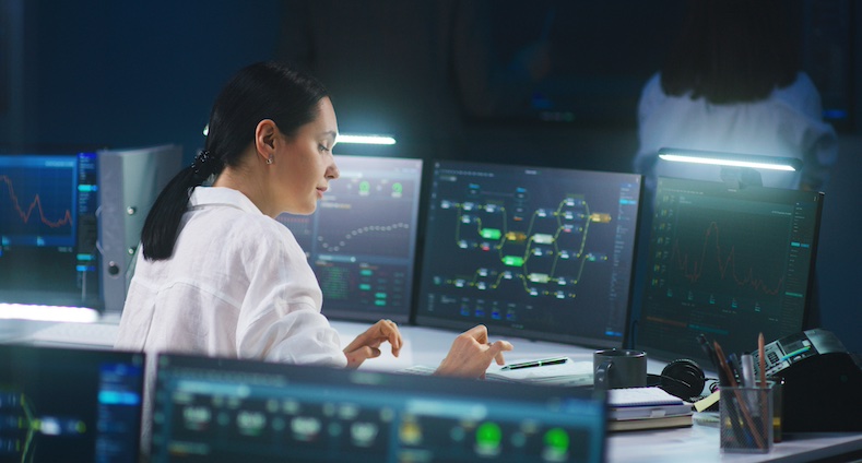 IT technical specialist works on computer with data server