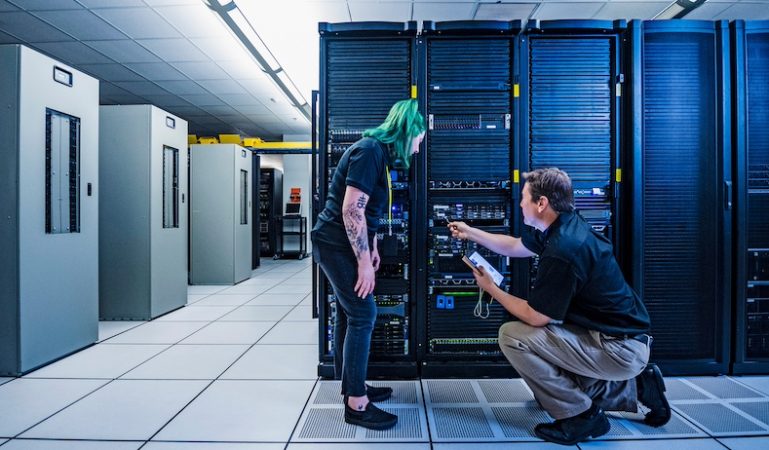Co-workers in data center server room
