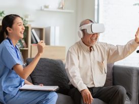 Happy senior man having fun with using VR enjoy at home