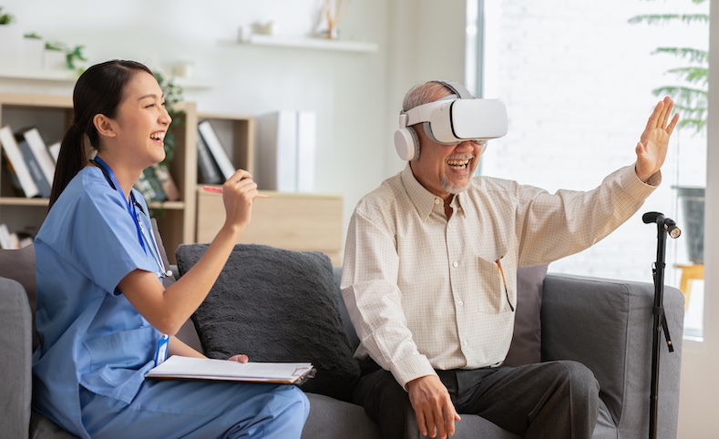 Happy senior man having fun with using VR enjoy at home